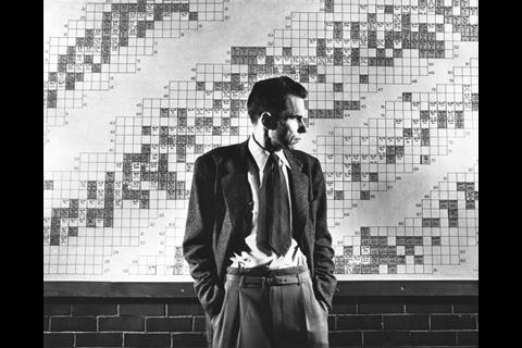 An image showing Glenn Seaborg in front of his periodic table